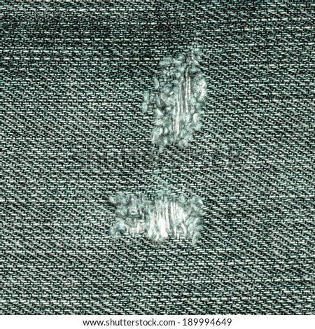 green worn jeans fabric