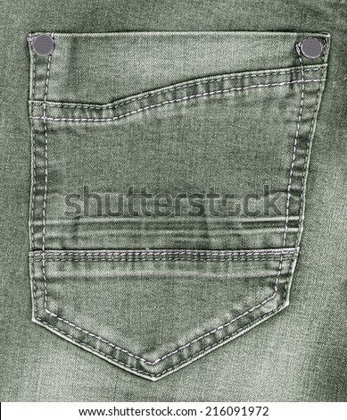back  pocket  on green jeans background