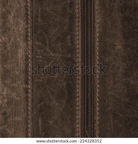 fragment of dark brown leather clothing accessories. seam,zipper. Useful as background