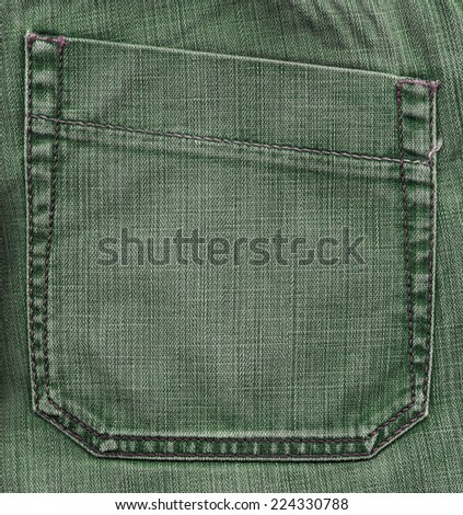 back pocket on green jeans background