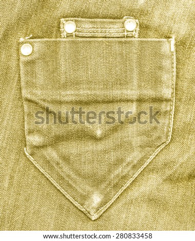 yellow jeans pocket on jeans background