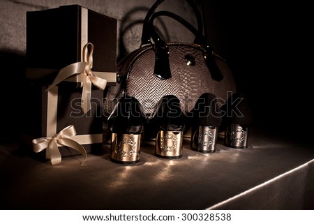 Composition black shoes with gold heels, gift boxes and luxury bag