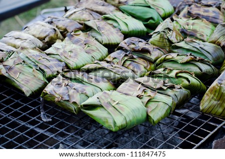 Fish with  curry paste wrapped in banana leaves, grilled on charcoal.