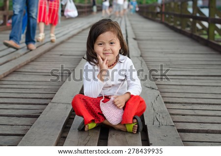 Sangklaburi,Thailand-May 4: Unidentified young asian girl with thanaka powder on face of this 