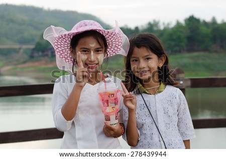 Sangklaburi,Thailand-May 3: Unidentified young asian girl with thanaka powder on face of this \