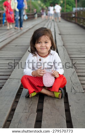 Sangklaburi,Thailand-May 2: Unidentified young asian girl with thanaka powder on face of this 