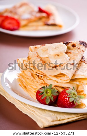 Photograph of a plate of crepes for dessert