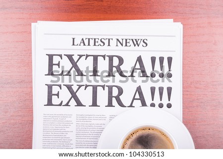 The newspaper LATEST NEWS with the headline EXTRA! EXTRA!  and coffee