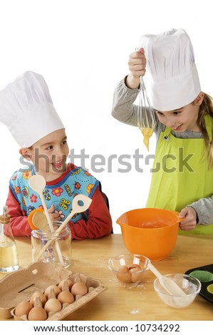 a brother and sister making fun in the kitchen and baking cake