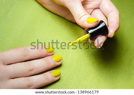 Green nails with a green brush in a green background!