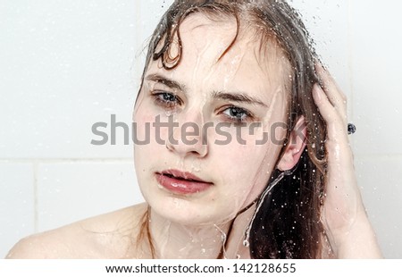 Lady having a big water drops shower