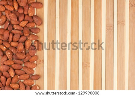 peeled almonds lying on a bamboo mat can be used as background