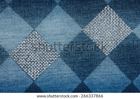 Fashionable background,  jeans in  rhinestones, texture