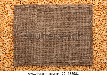 Frame made of burlap with the line lies on  peas seeds, with place for your text