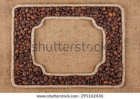 Two frames made of rope with  coffee  beans on sackcloth, as background, texture