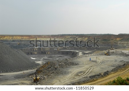 Open-pit mining for lignite (brown coal) that is burnt and transformed to electricity by the power station