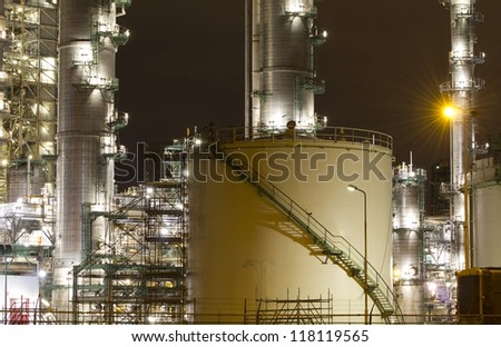 Petrochemical-tanks and a large oil-refinery plant at night