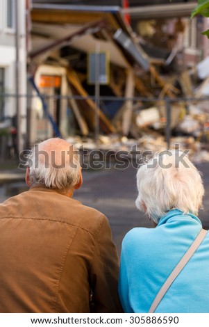 People looking at the destruction after the incident of overturned cranes when lifting a heavy bridge section, Alphen aan den Rijn, The Netherlands