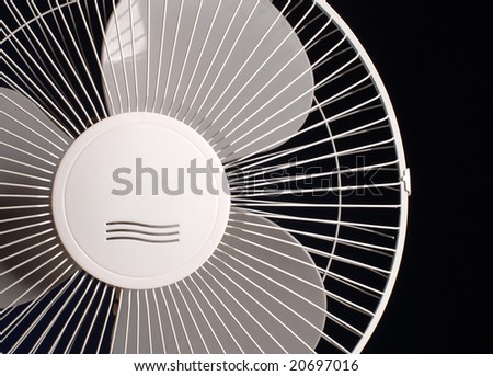 Fragment of the white fan on a black background