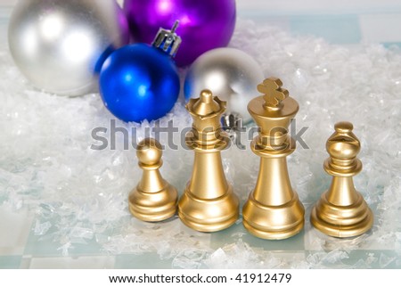 Christmas chess and snow on a dark background
