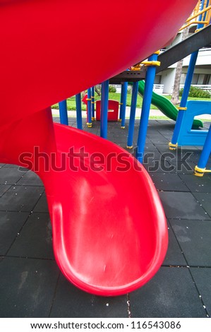 Picture of Red plastic slider playgrounds object at park