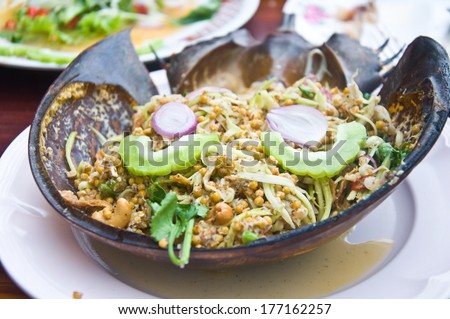 spicy Salad made with horseshoe crab eggs and mix vegetable on shell horseshoe crab