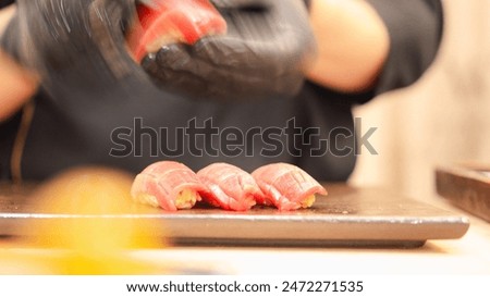 Similar – Image, Stock Photo Crop chef preparing sushi at table in restaurant