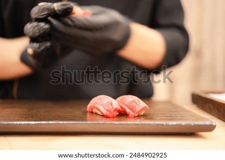 Similar – Image, Stock Photo Crop chef preparing sushi at table in restaurant