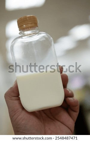 Similar – Image, Stock Photo Man taking milk box from the fridge