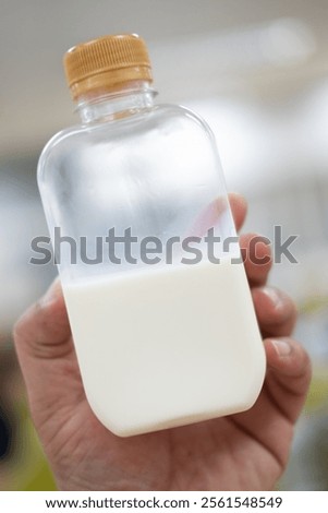 Similar – Image, Stock Photo Man taking milk box from the fridge