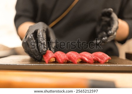 Similar – Image, Stock Photo Crop chef preparing sushi at table in restaurant