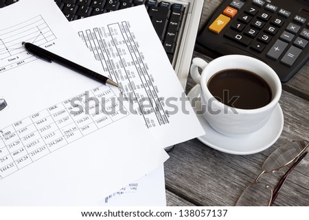Finance and office objects concept with coffee near