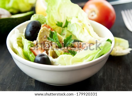 Bowl of Healthy Salad with Vegetables and Seeds