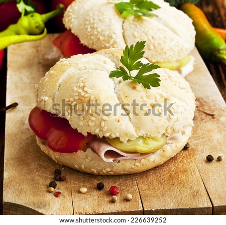 Fresh Ham Sandwiches with Pepper and Parsley on Wooden Board