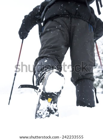Hiker Male Boots Walking on Snow.Winter Equipment and Sport.Hiking