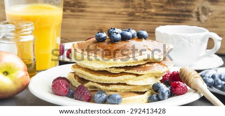 Breakfast Honey Pancakes with Blueberries and Raspberries,Coffee and Juice