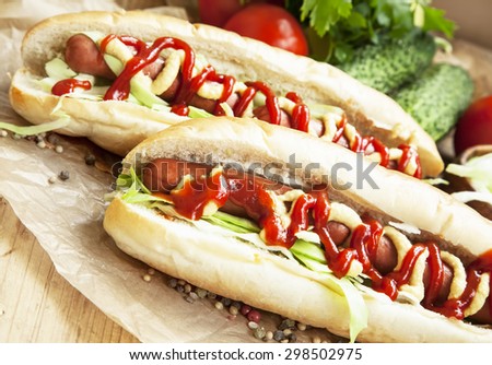 Hot-Dog Meal.Sausages with Bread Buns,Lettuce, Mustard and Ketchup Sauces