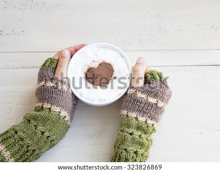 Holding Coffee Latte Cup with Cocoa Shape and Cozy Wool Hands Warmers