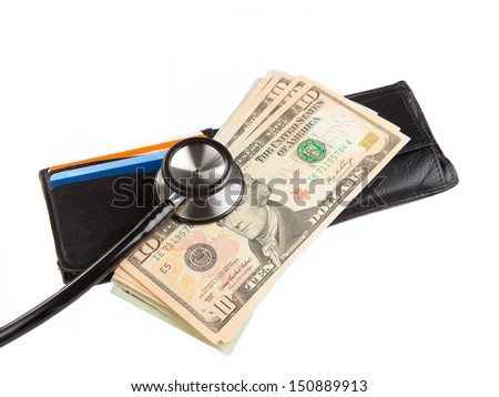 Stethoscope on wallet with stack of ten dollar bills