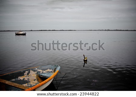 Lonely Boat, Old decrepit boat sitting alongside pier