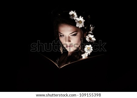 Girl with chamomile with mystic light
