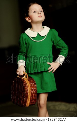 Portrait of lovely girl dressed in green dress