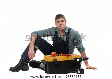 Mechanic with tools isolated on the white background
