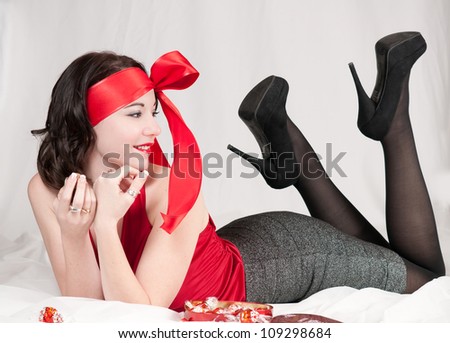 Beautiful pin-up girl portrait looking at feet