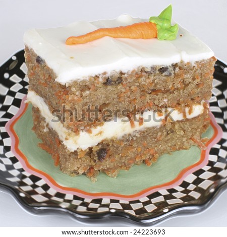 A piece of carrot cake on a plate.