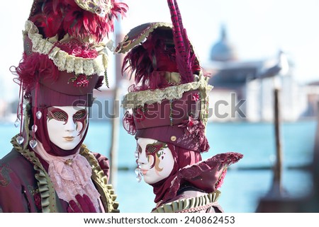A masked couple exhibited during the traditional festival of Carnival of Venice, Italy (2014 edition)