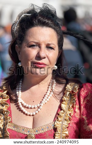 VENICE, ITALY - February 23: An unidentified woman wears historical dresses during the traditional festival of Carnival on February 23, 2014 in Venice, Italy