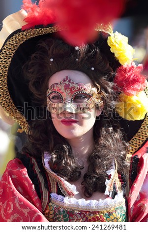 VENICE, ITALY - February 23: An unidentified young woman masked with historical dresses during the traditional festival of Carnival on February 23, 2014 in Venice, Italy