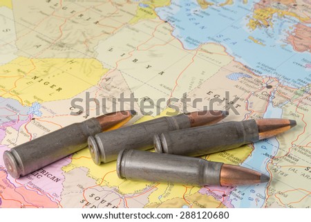Four bullets on the geographical map of Egypt, Lybia, Algeria and Niger in North Africa. Conceptual image for war, conflict, violence.
