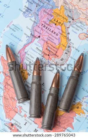 Four bullets on the geographical map of Thailand, Vietnam and Laos. Conceptual image for war, conflict, violence.